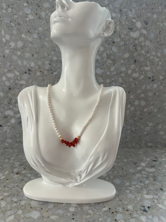 White beaded necklace with coral