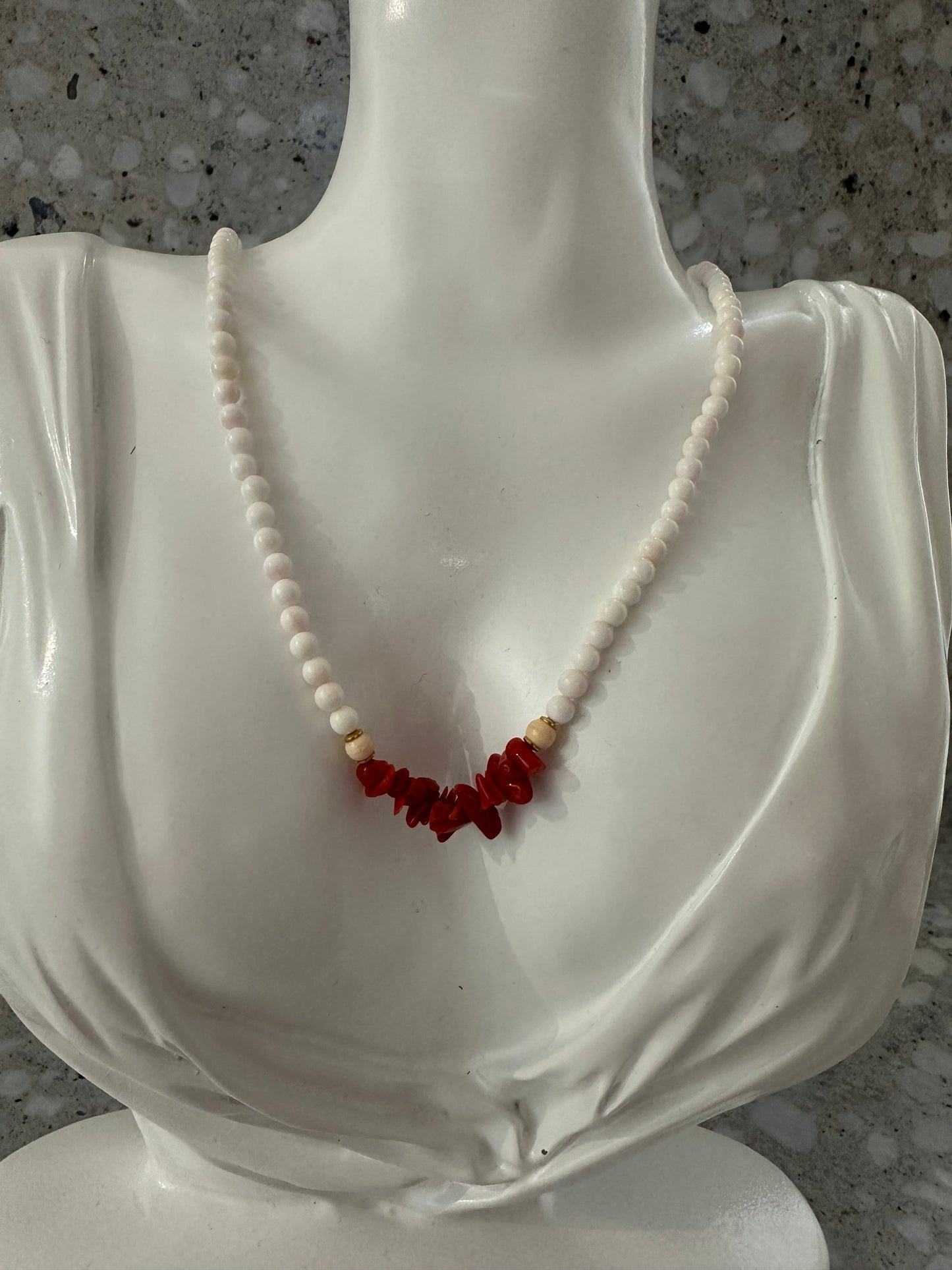 White beaded necklace with coral